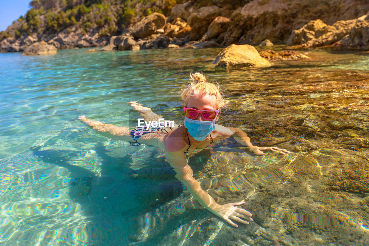 Woman swimming in sea