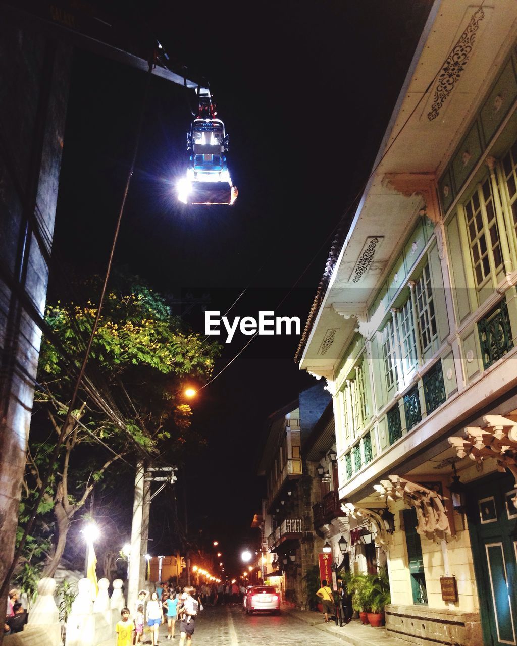 NIGHT VIEW OF ILLUMINATED STREET LIGHT