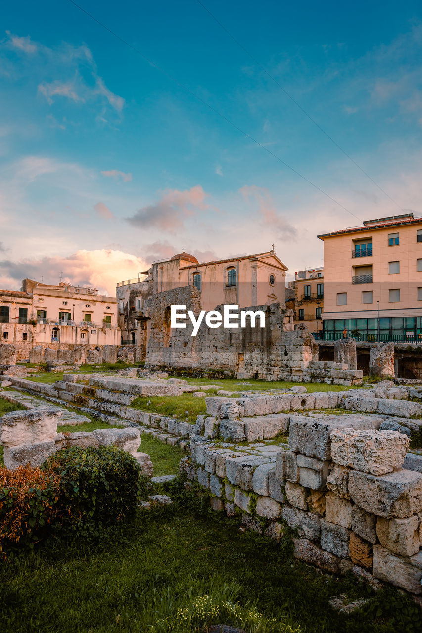 Temple of apollo in the centre of ortigia, syracuse at sunset