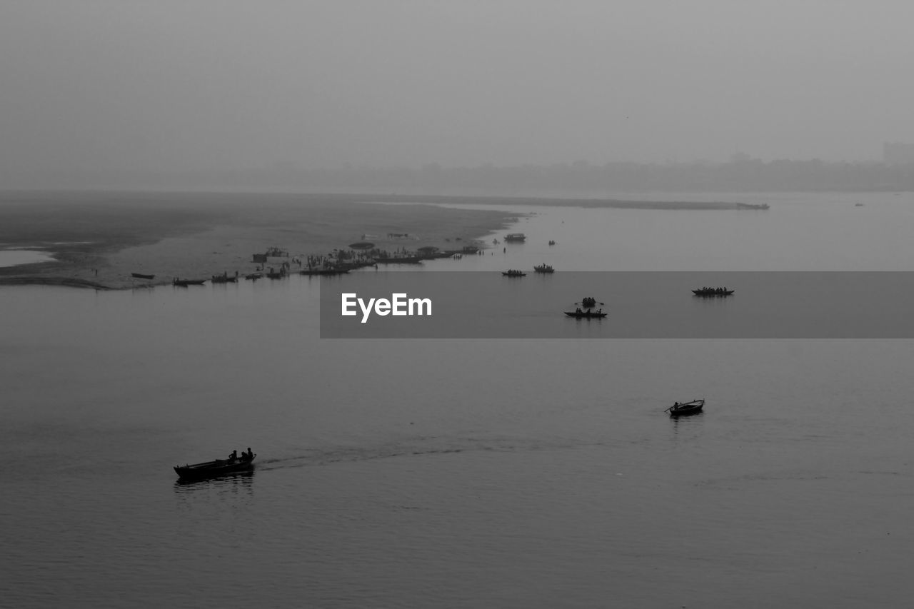 Boats moored in sea