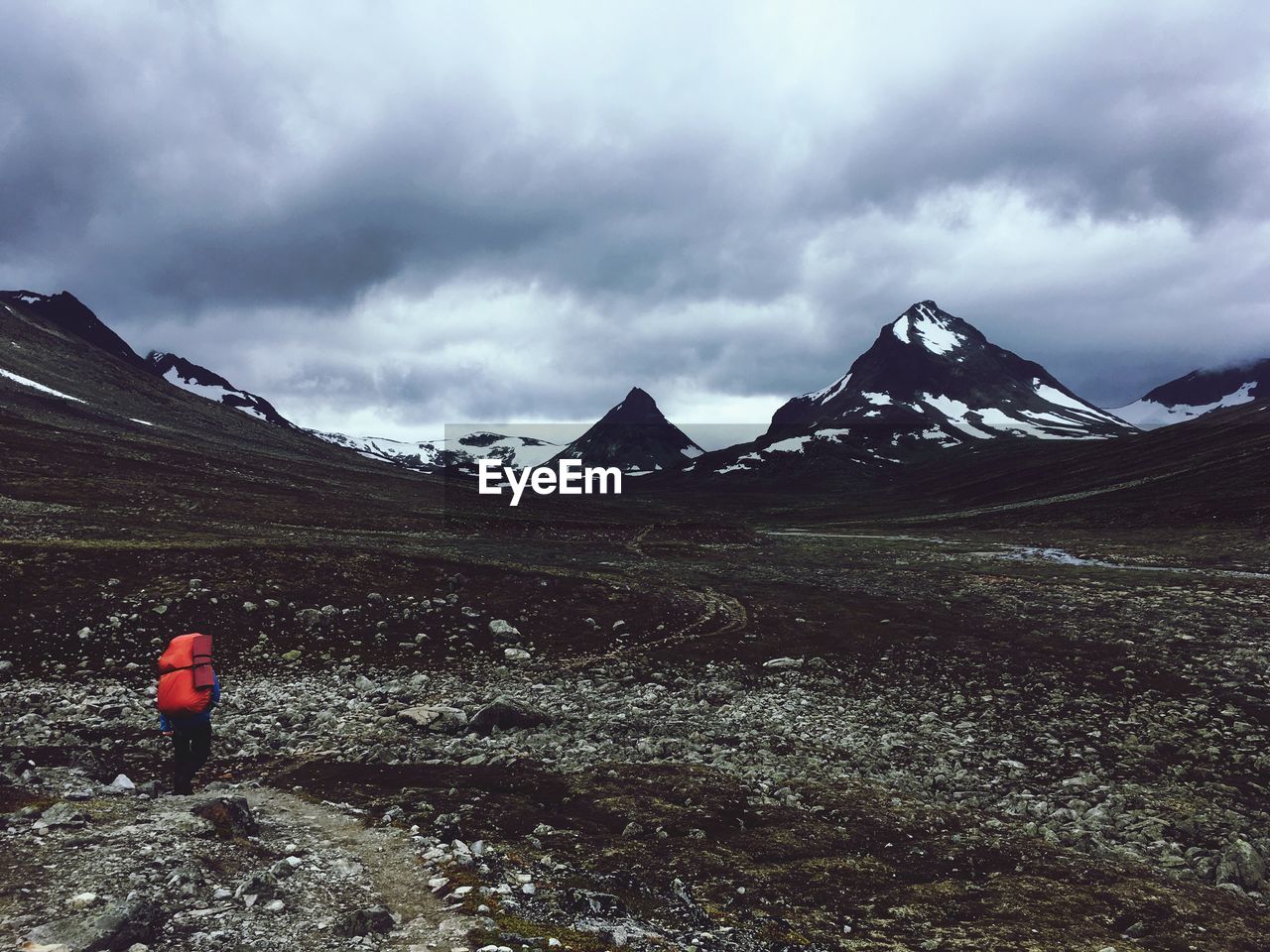 REAR VIEW OF SNOWCAPPED MOUNTAINS AGAINST SKY