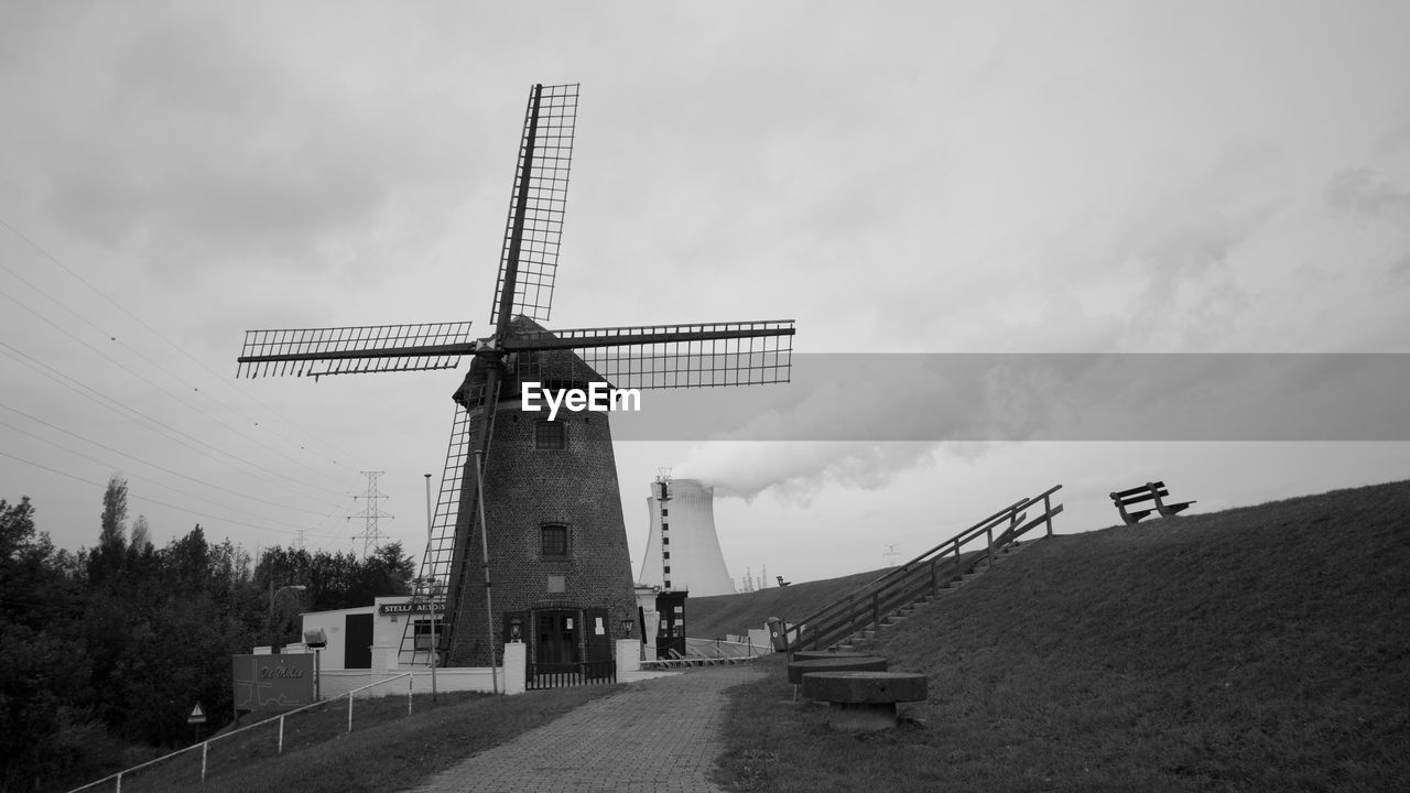 Traditional windmill against sky