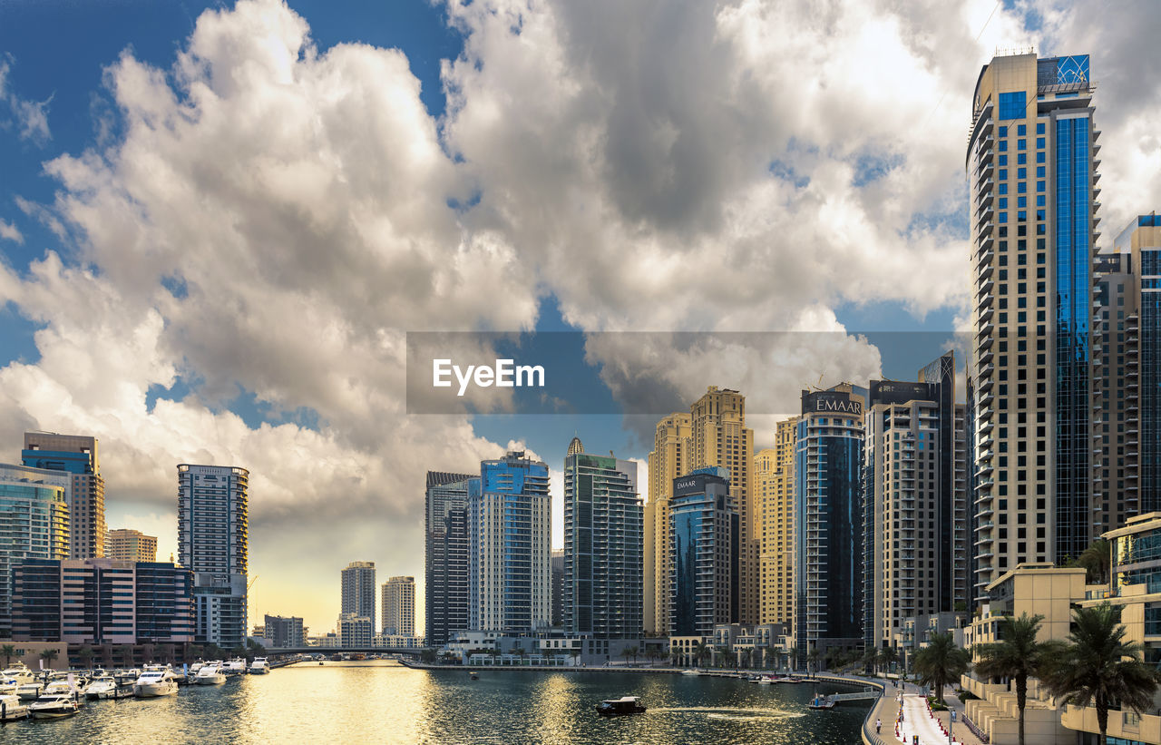 PANORAMIC VIEW OF MODERN BUILDINGS AGAINST SKY