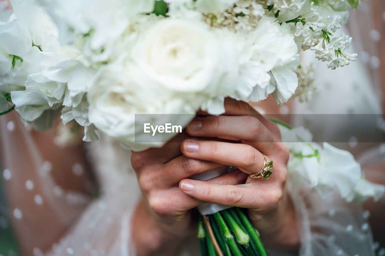 Close-up of hand holding bouquet