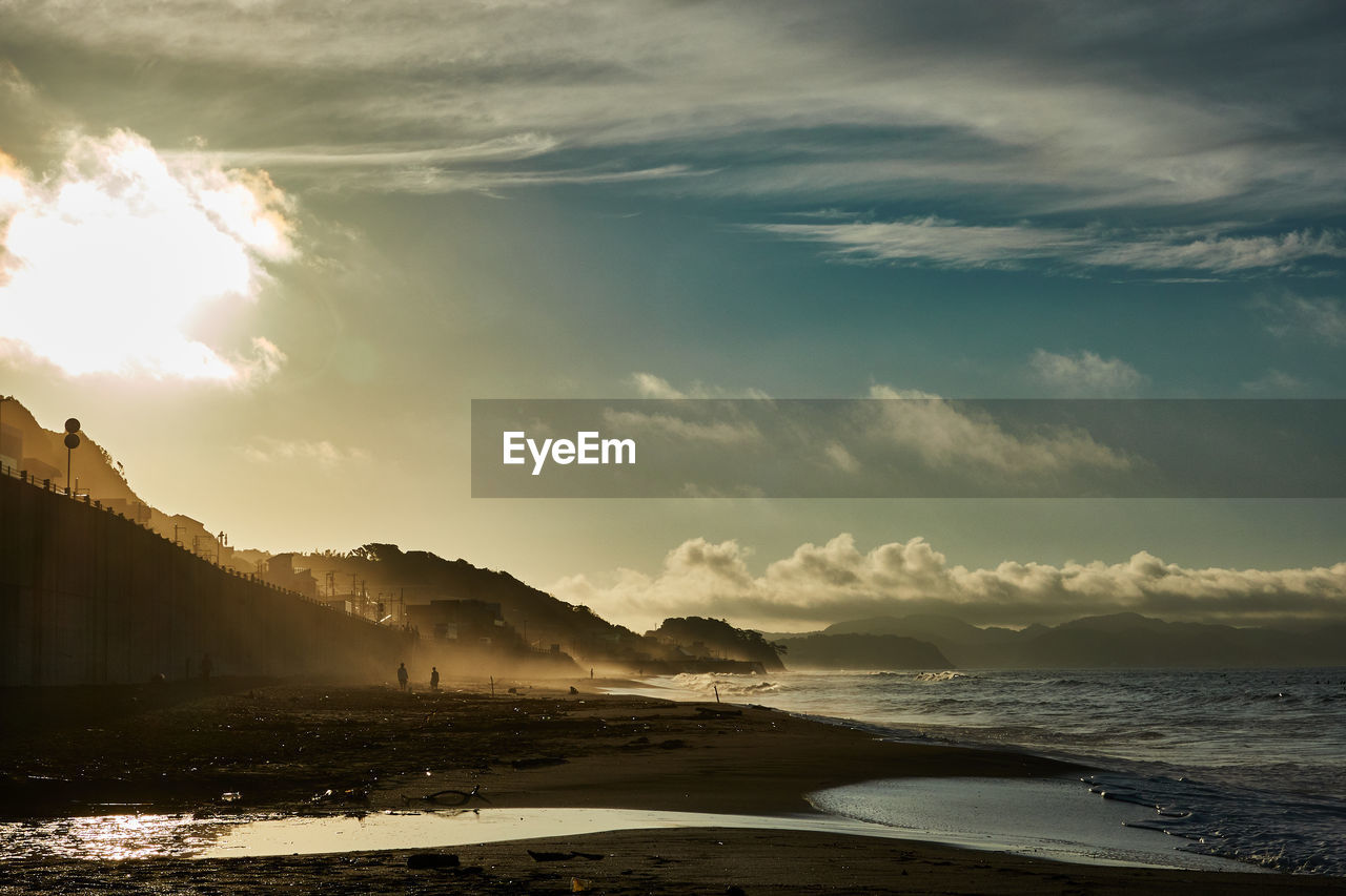 Scenic view of sea against sky during sunrise