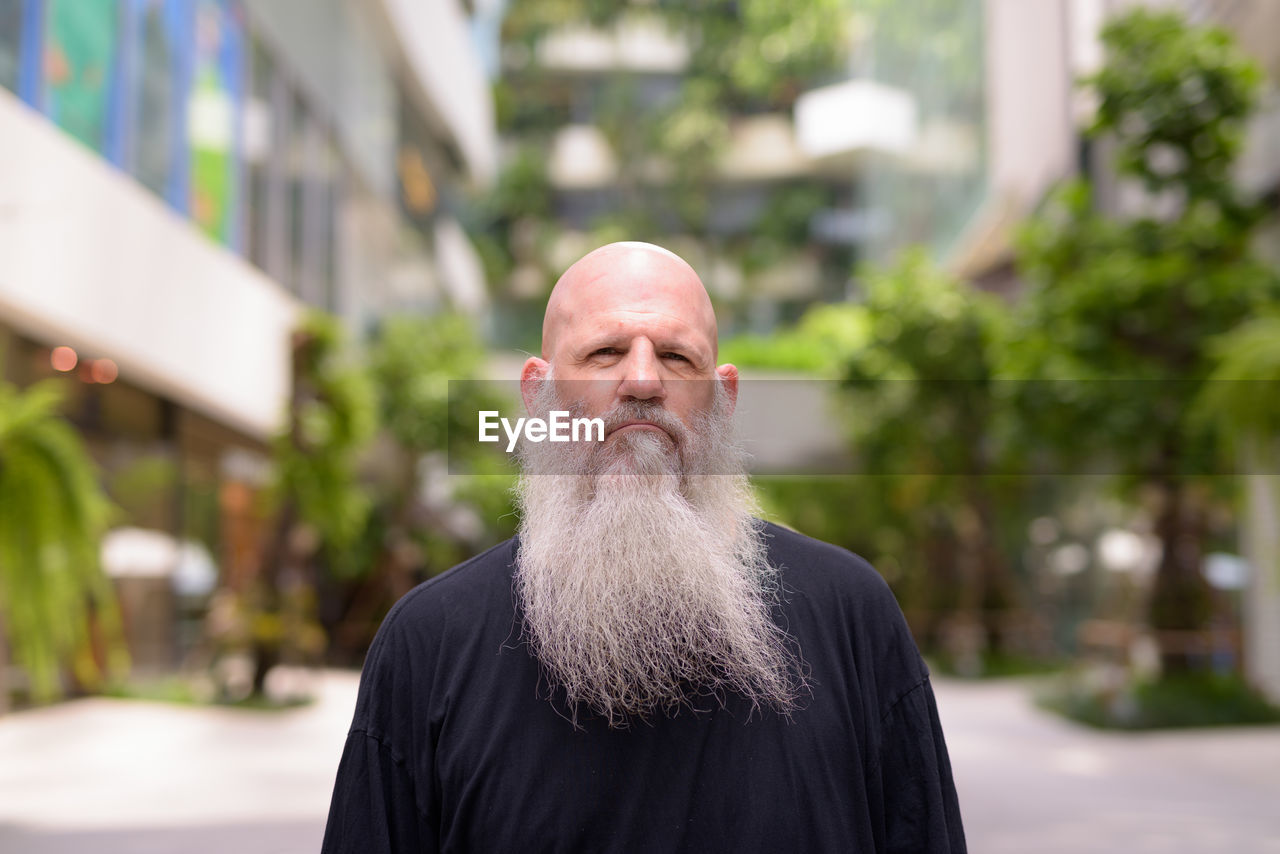 Portrait of man standing outdoors