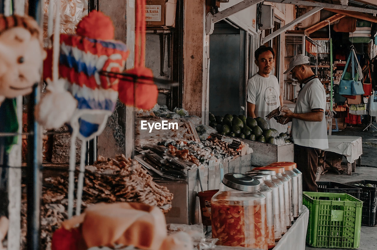 Group of people at market stall