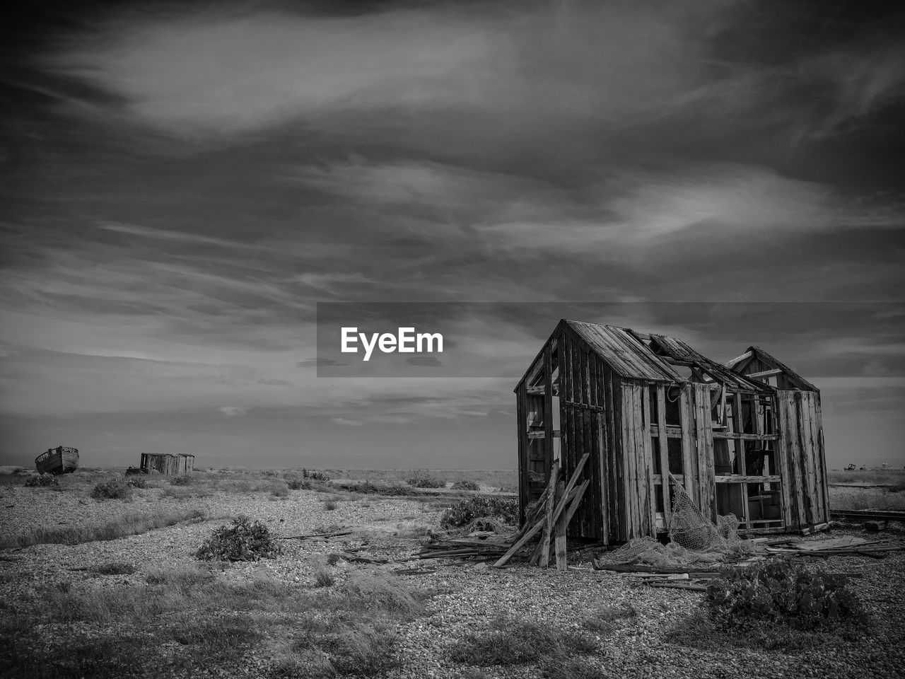 Derelict fisherman's shed, dungeness beach, kent, uk. shot in black and white. 