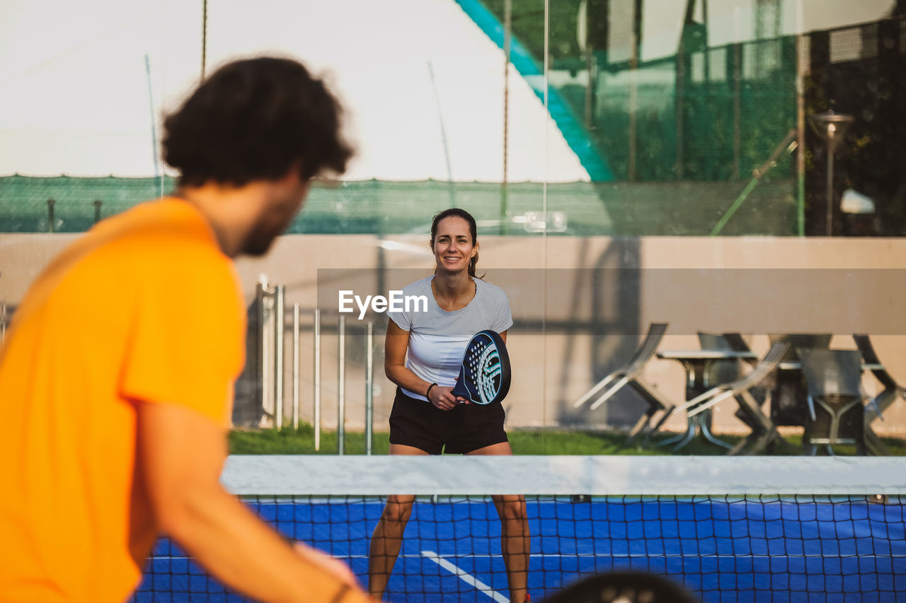 Tennis players playing at court