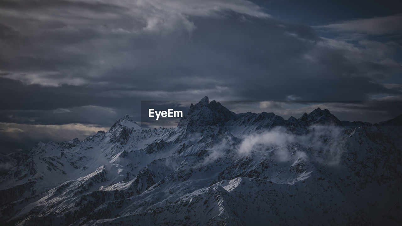 SNOWCAPPED MOUNTAINS AGAINST SKY