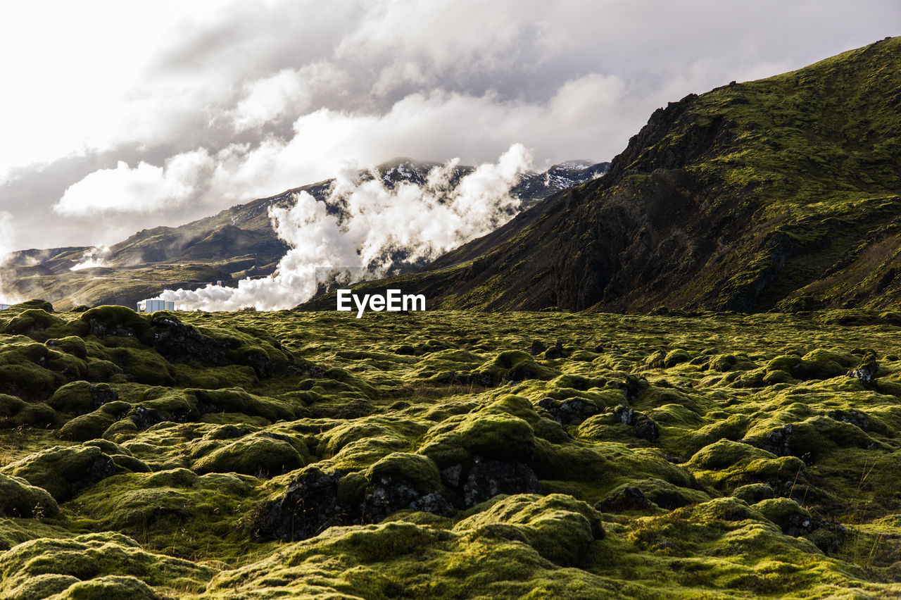 Scenic view of volcanic landscape against sky, ion hotel, iceland.