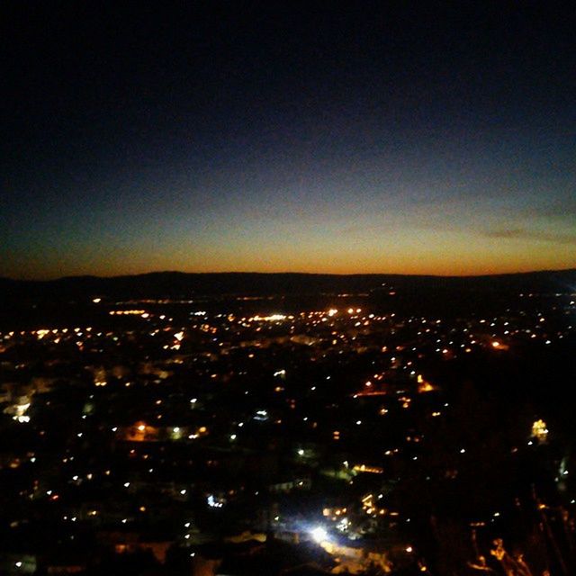 VIEW OF CITYSCAPE AT NIGHT