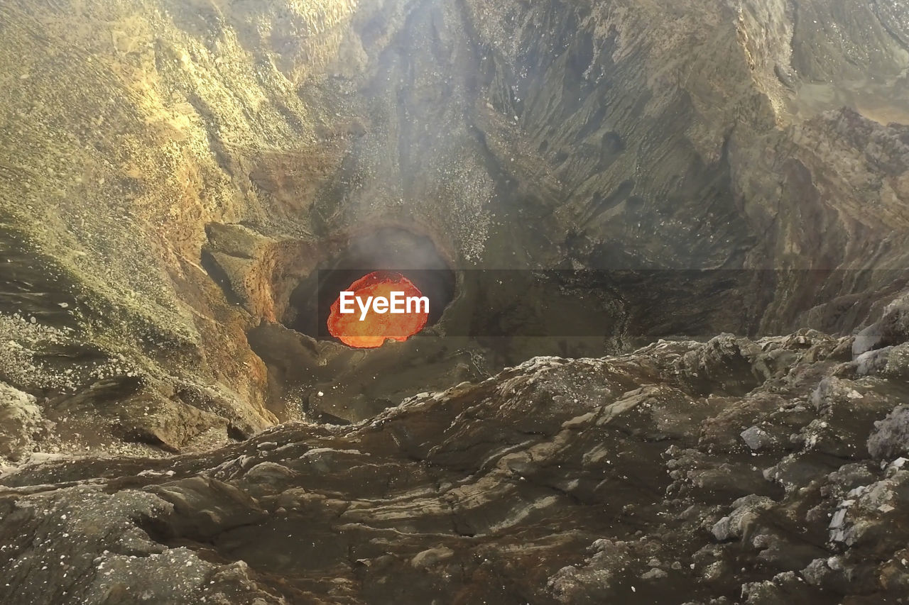 SCENIC VIEW OF CAVE ON MOUNTAIN