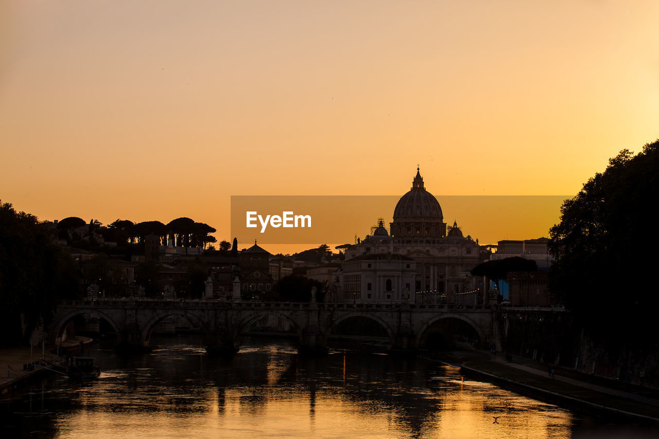 The sunset falls over the beautiful constantinian basilica of st. peter at the vatican city