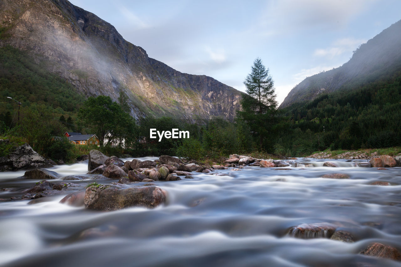 SURFACE LEVEL VIEW OF STREAM AGAINST SKY