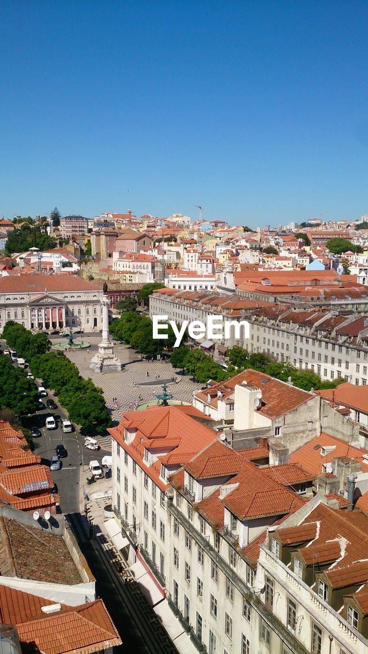 HIGH ANGLE SHOT OF TOWNSCAPE AGAINST CLEAR BLUE SKY