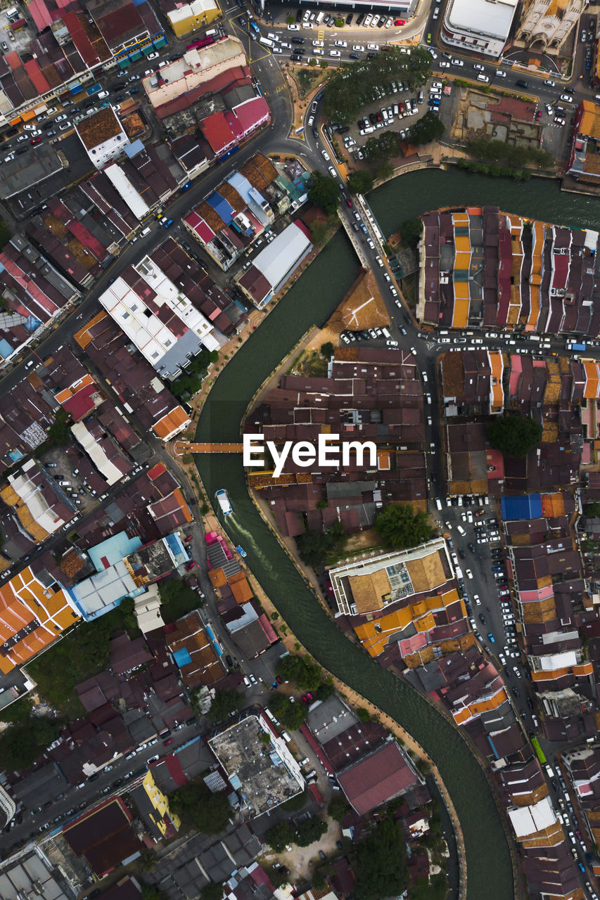 Aerial view of river and houses in city