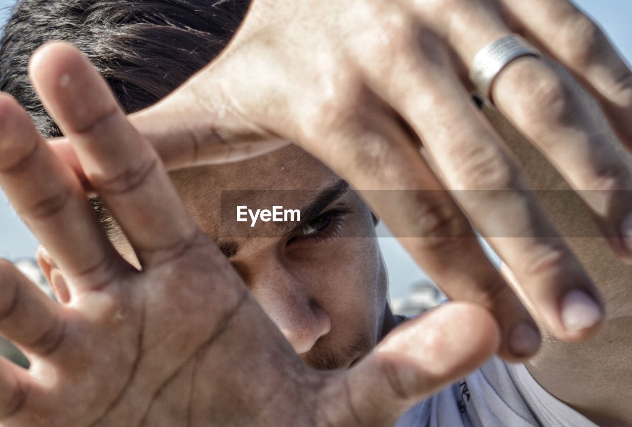 Close-up of teenage boy gesturing