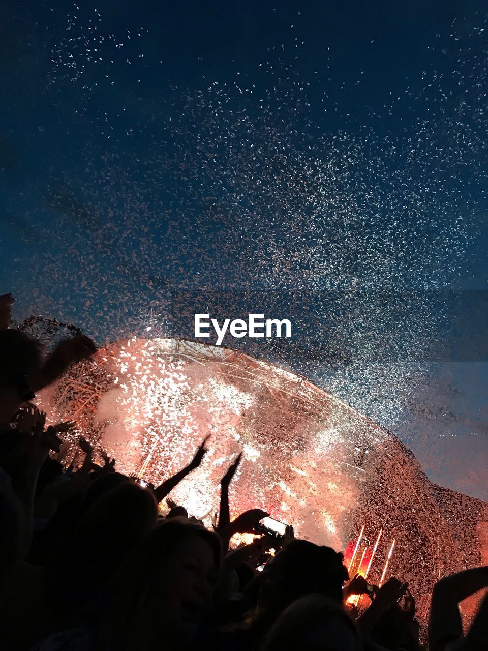 LOW ANGLE VIEW OF FIREWORKS AGAINST SKY