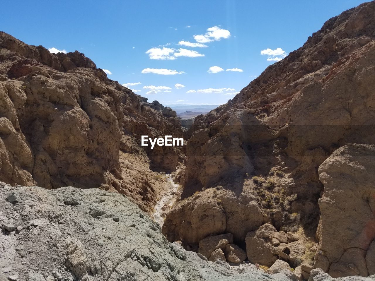 SCENIC VIEW OF ROCKS AGAINST SKY