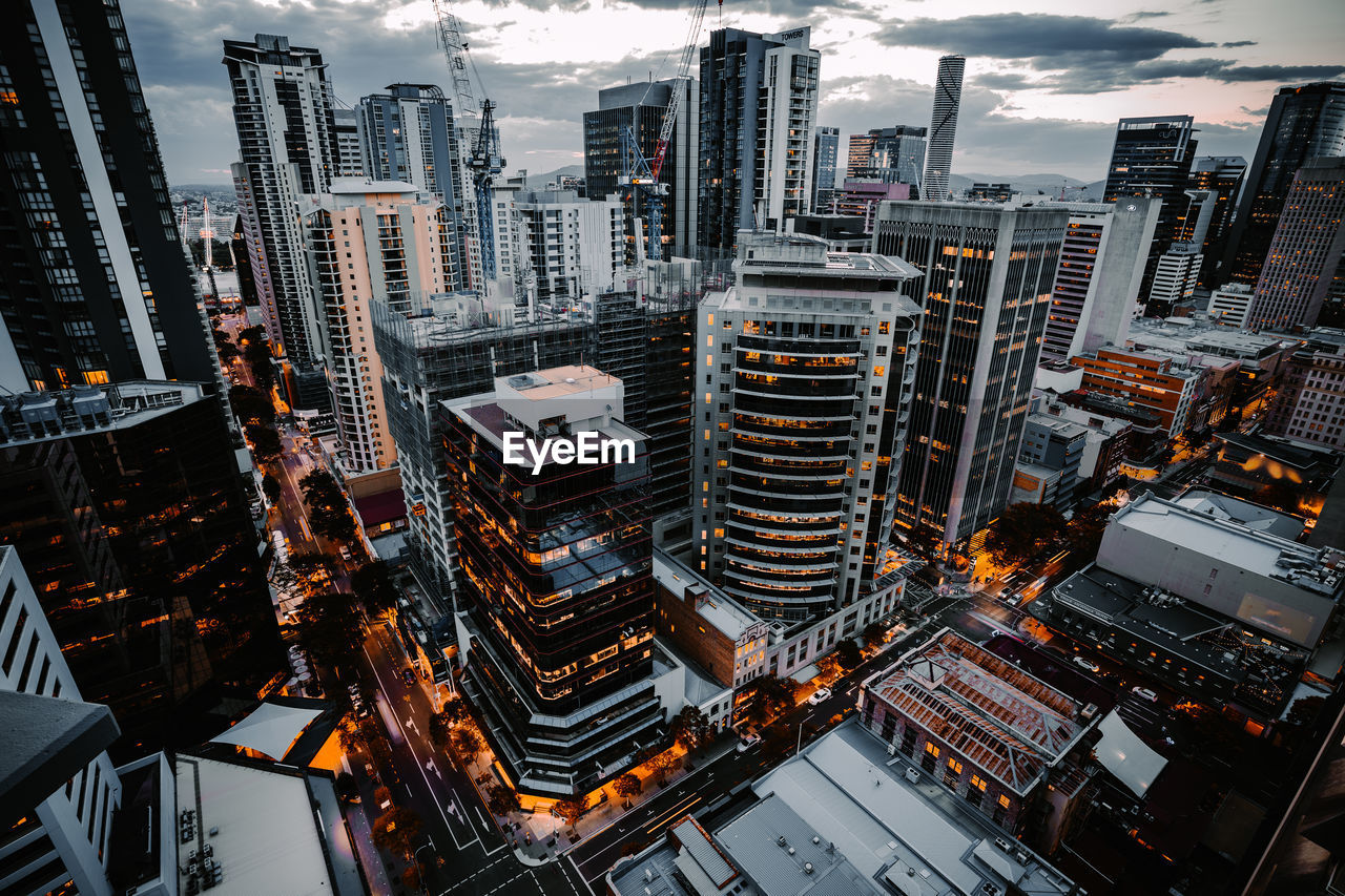 High angle view of modern buildings in city against sky