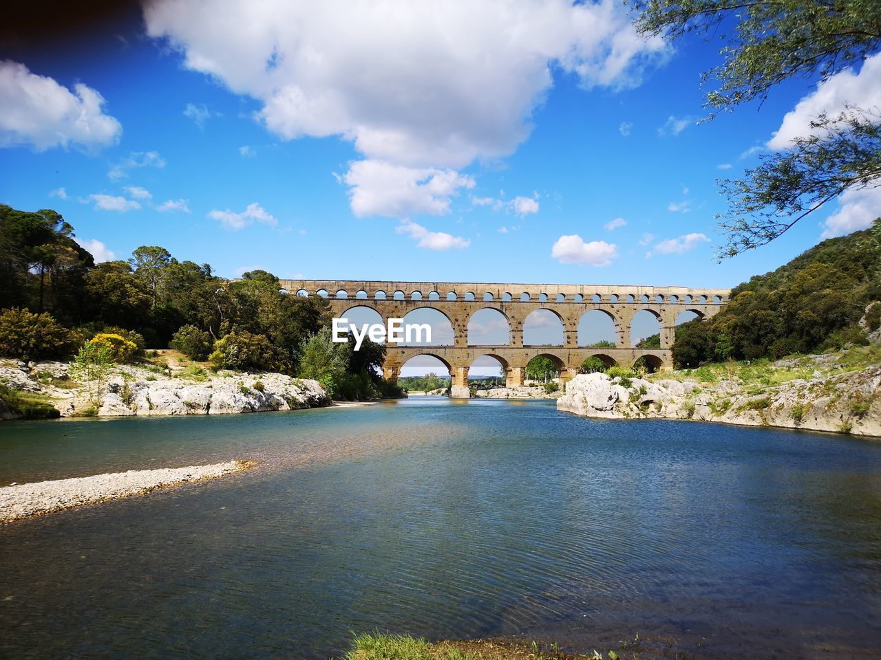 Bridge over river against sky