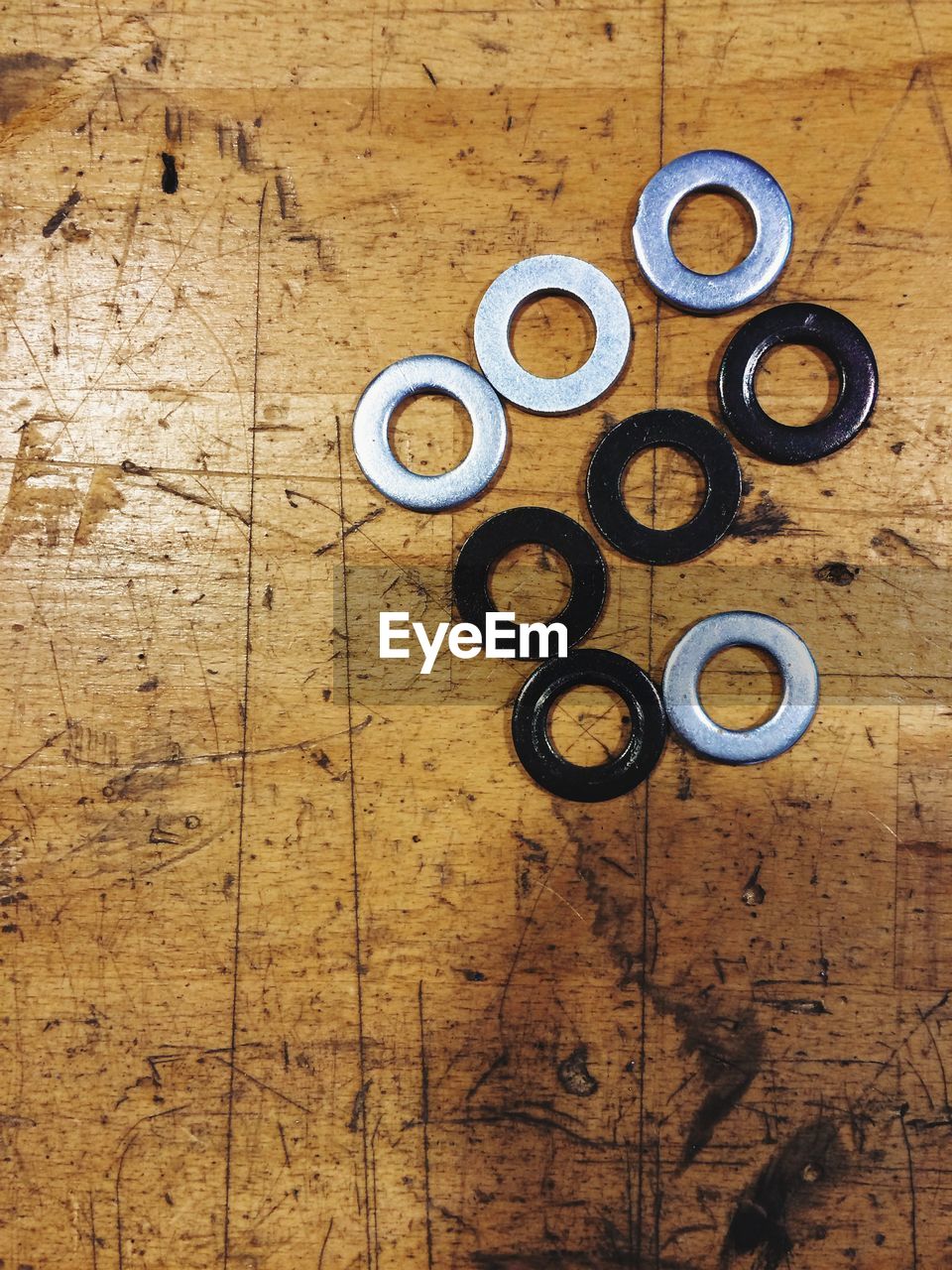 Directly above shot of washers on wooden table