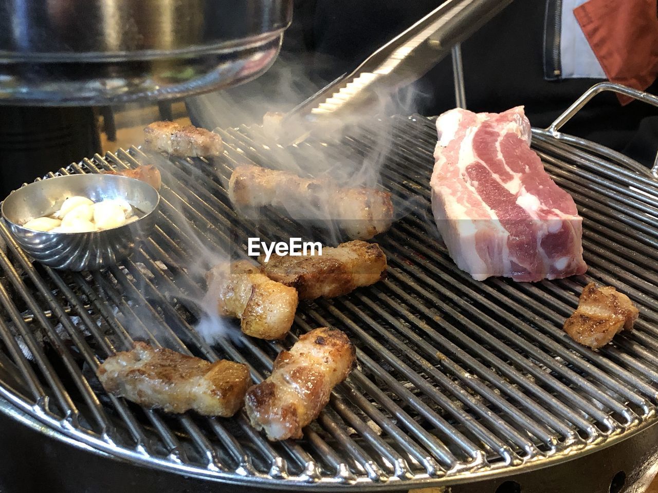 High angle view of meat on barbecue