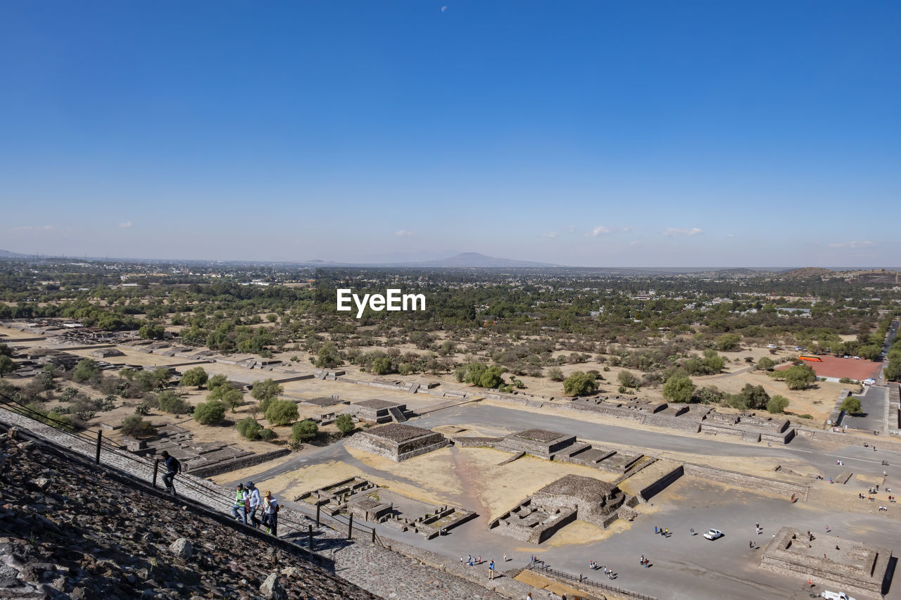 HIGH ANGLE SHOT OF TOWNSCAPE AGAINST CLEAR BLUE SKY