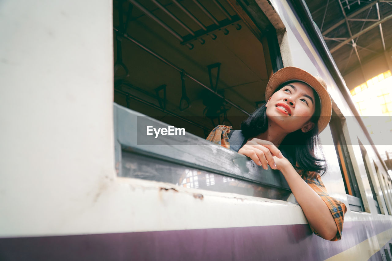 Woman peeking from train window