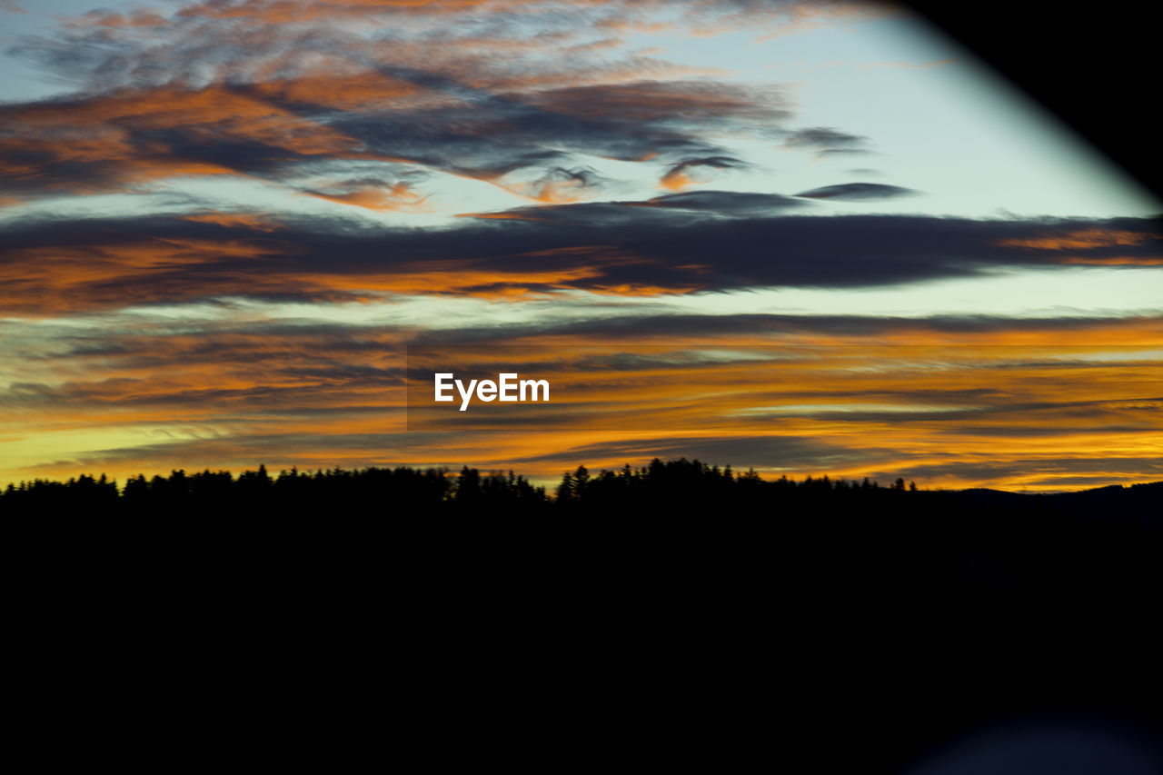 SCENIC VIEW OF DRAMATIC SKY DURING SUNSET