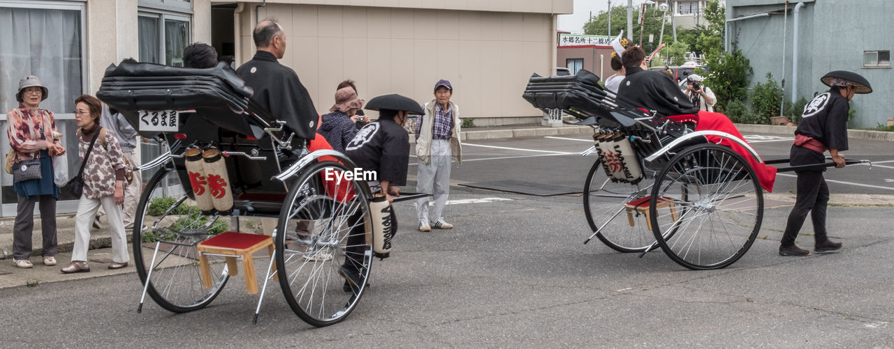 MAN RIDING BICYCLE ON ROAD