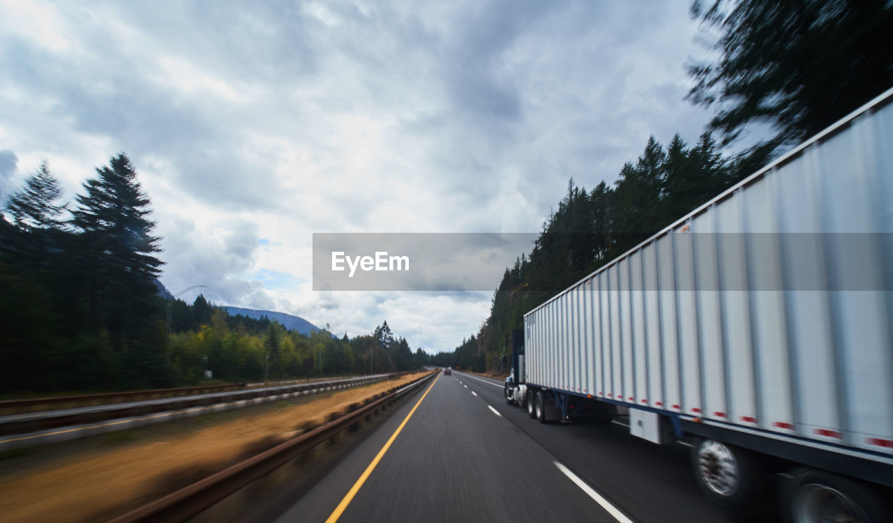 PANORAMIC SHOT OF ROAD AGAINST SKY