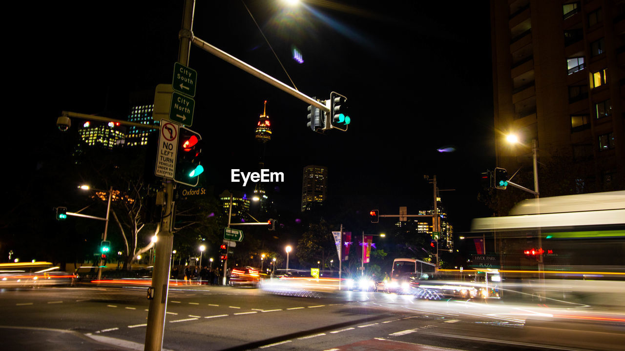 ILLUMINATED CITY STREET AT NIGHT