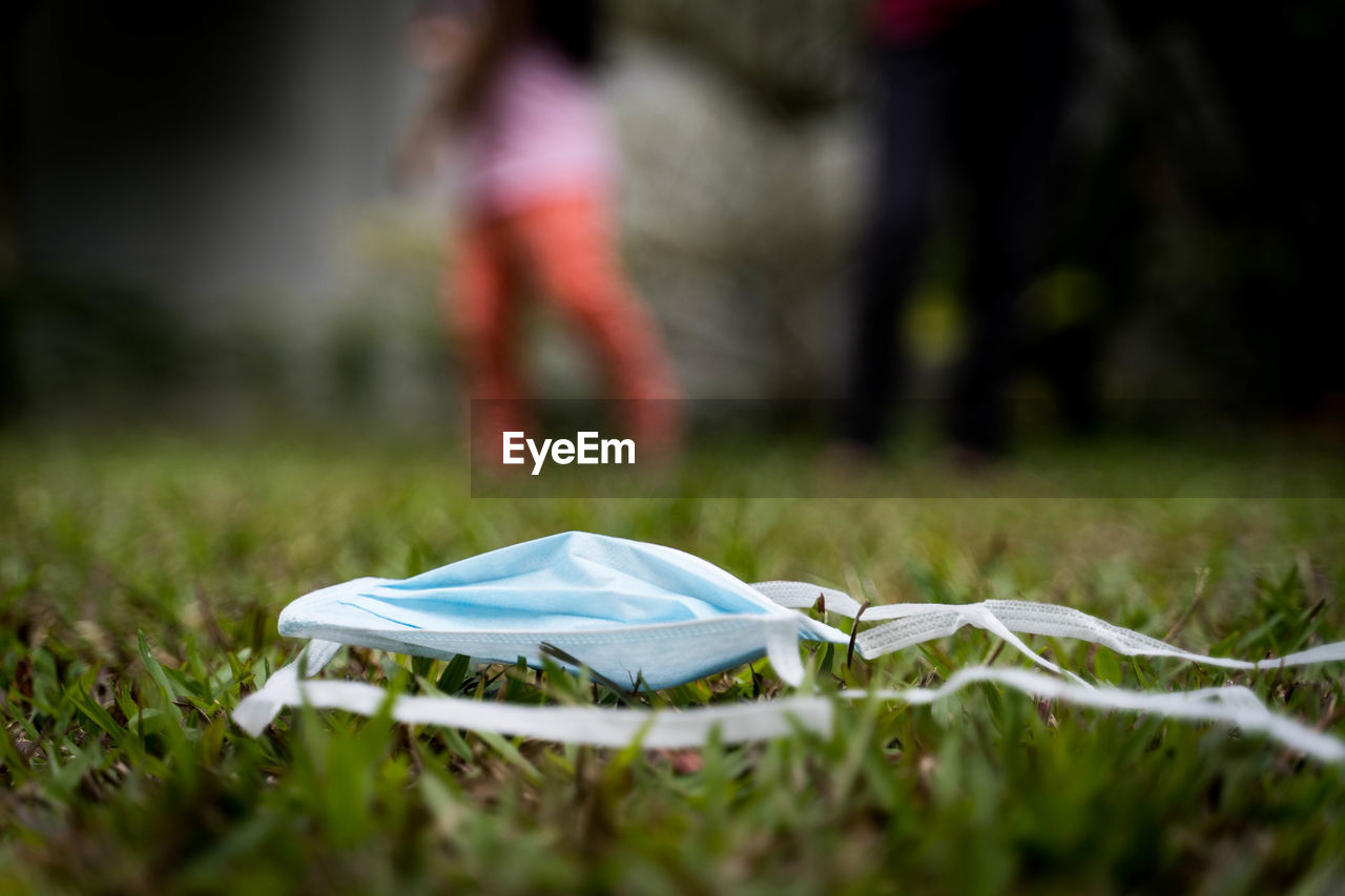 LOW SECTION OF MAN ON GRASS FIELD