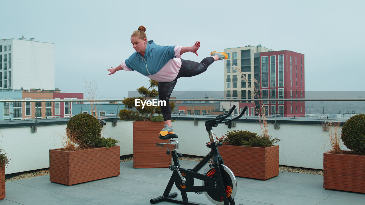 side view of young man exercising on chair