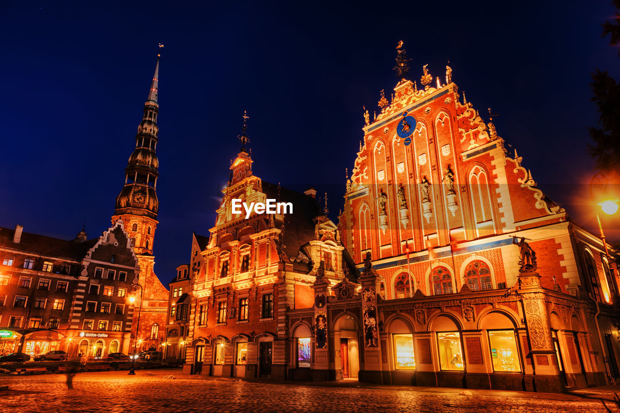 LOW ANGLE VIEW OF ILLUMINATED CATHEDRAL AGAINST SKY