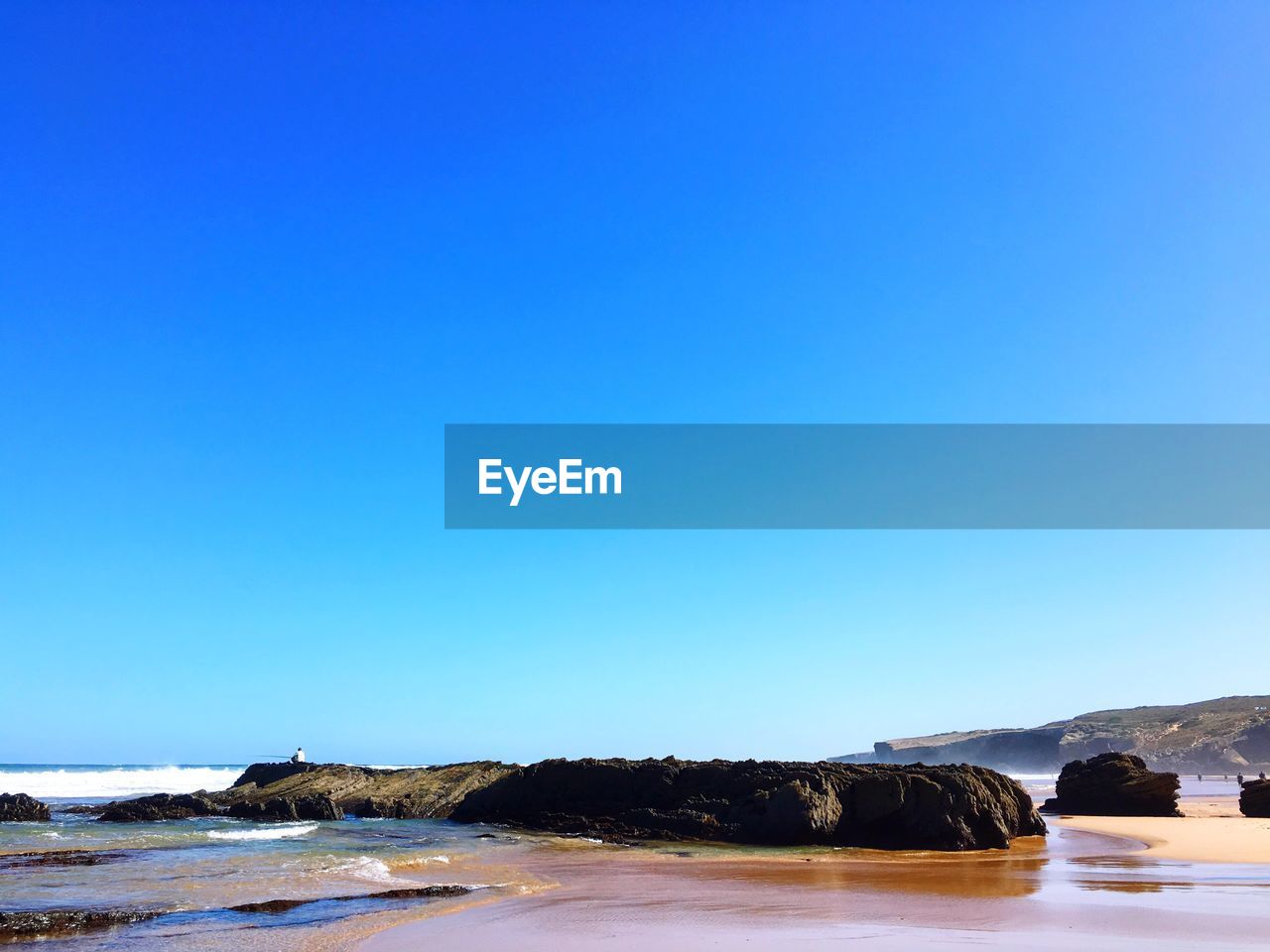 Scenic view of sea against clear sky