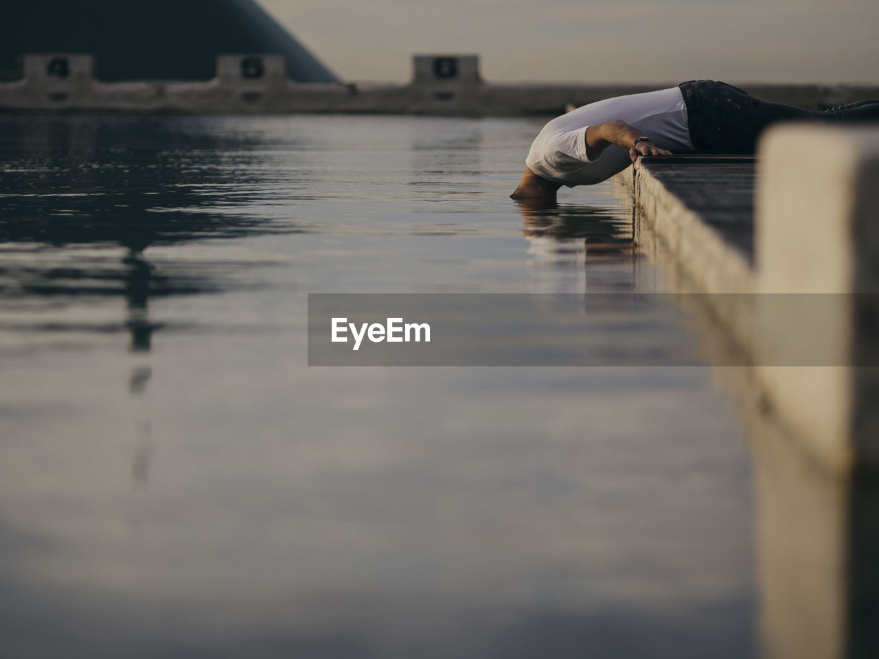 Man putting his head in water