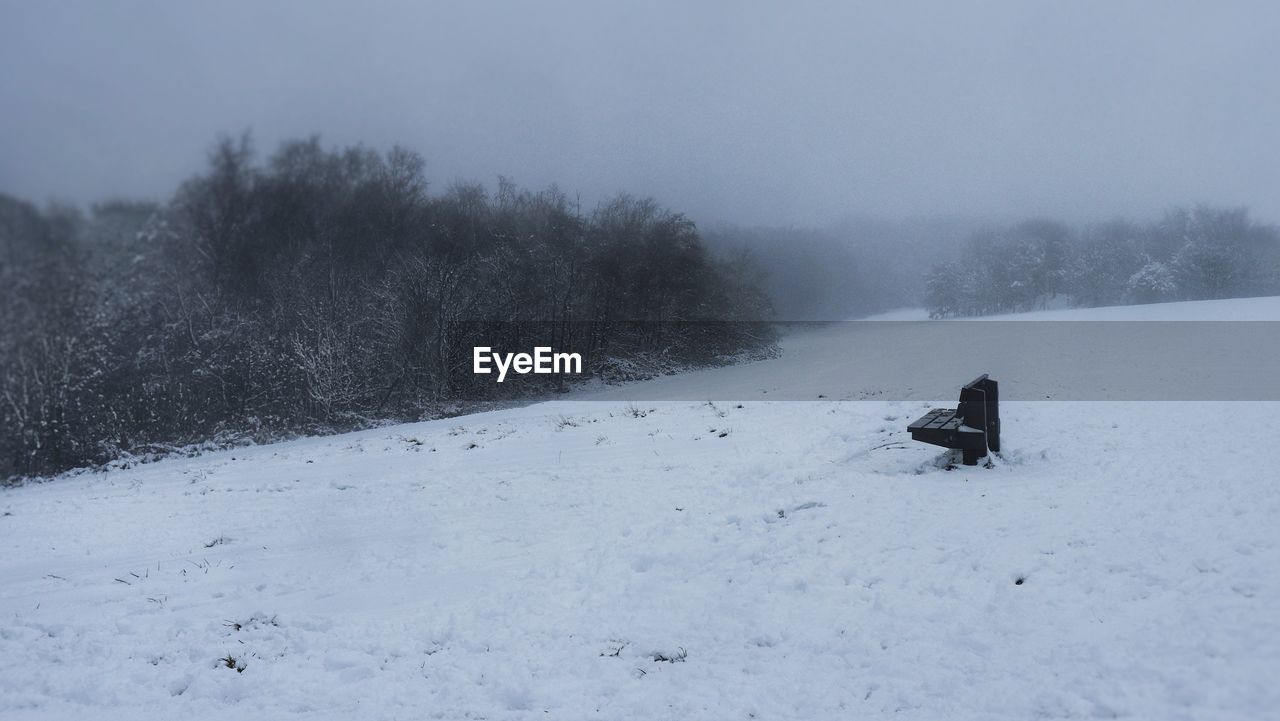 SCENIC VIEW OF SNOW COVERED LAND