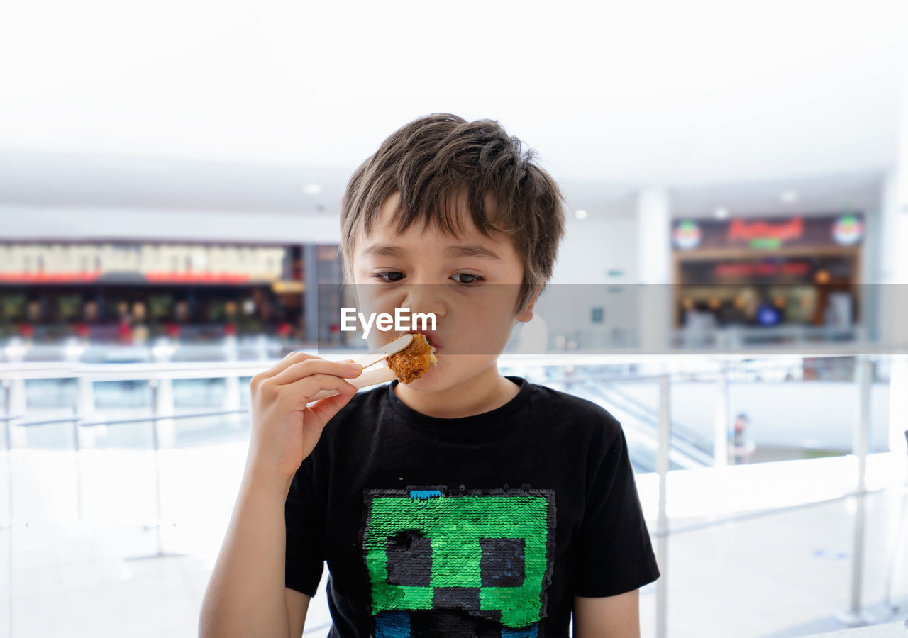 Portrait of boy holding ice cream