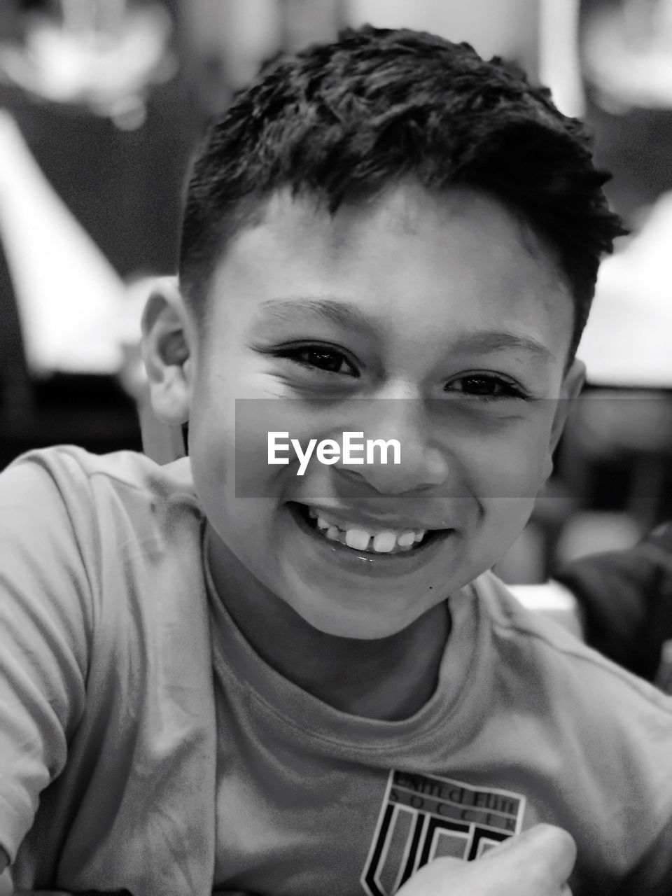 CLOSE-UP PORTRAIT OF BOY SMILING