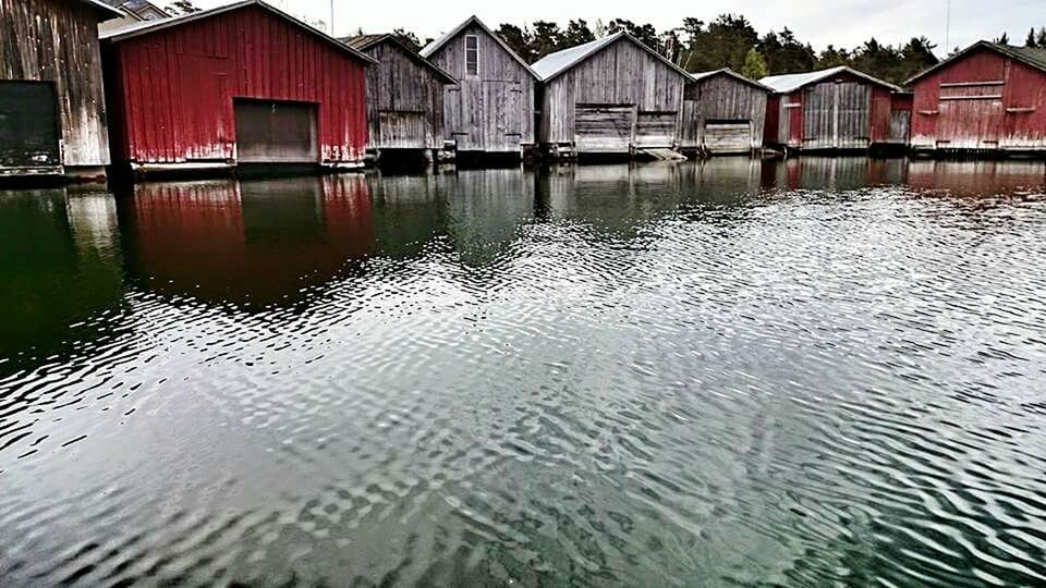 REFLECTION OF HOUSES IN WATER