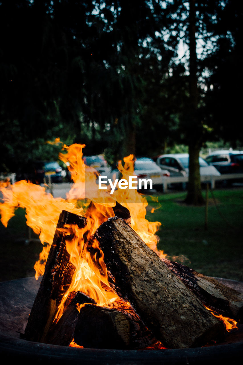 Bonfire against cars at park