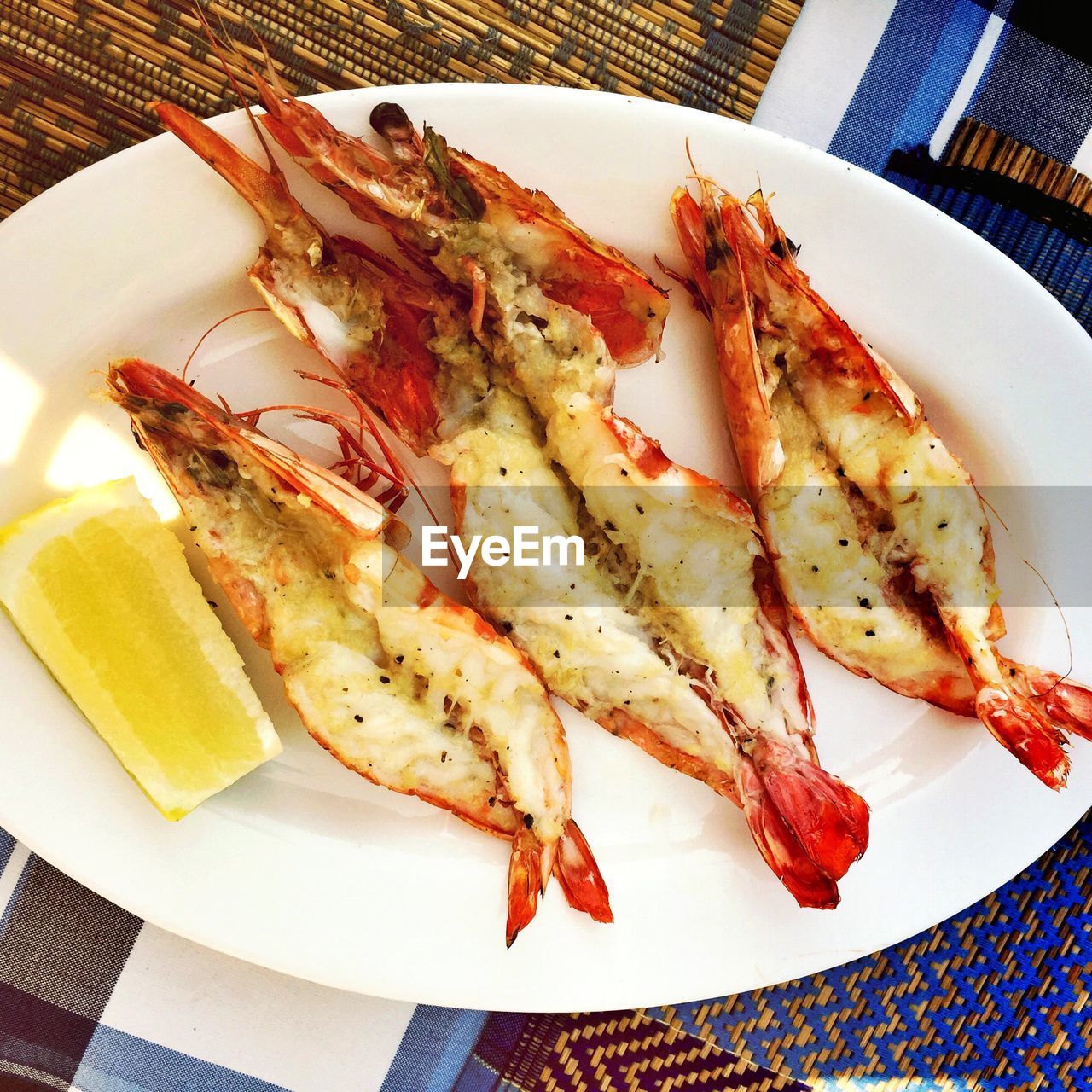Close-up of grilled prawns served in plate on table