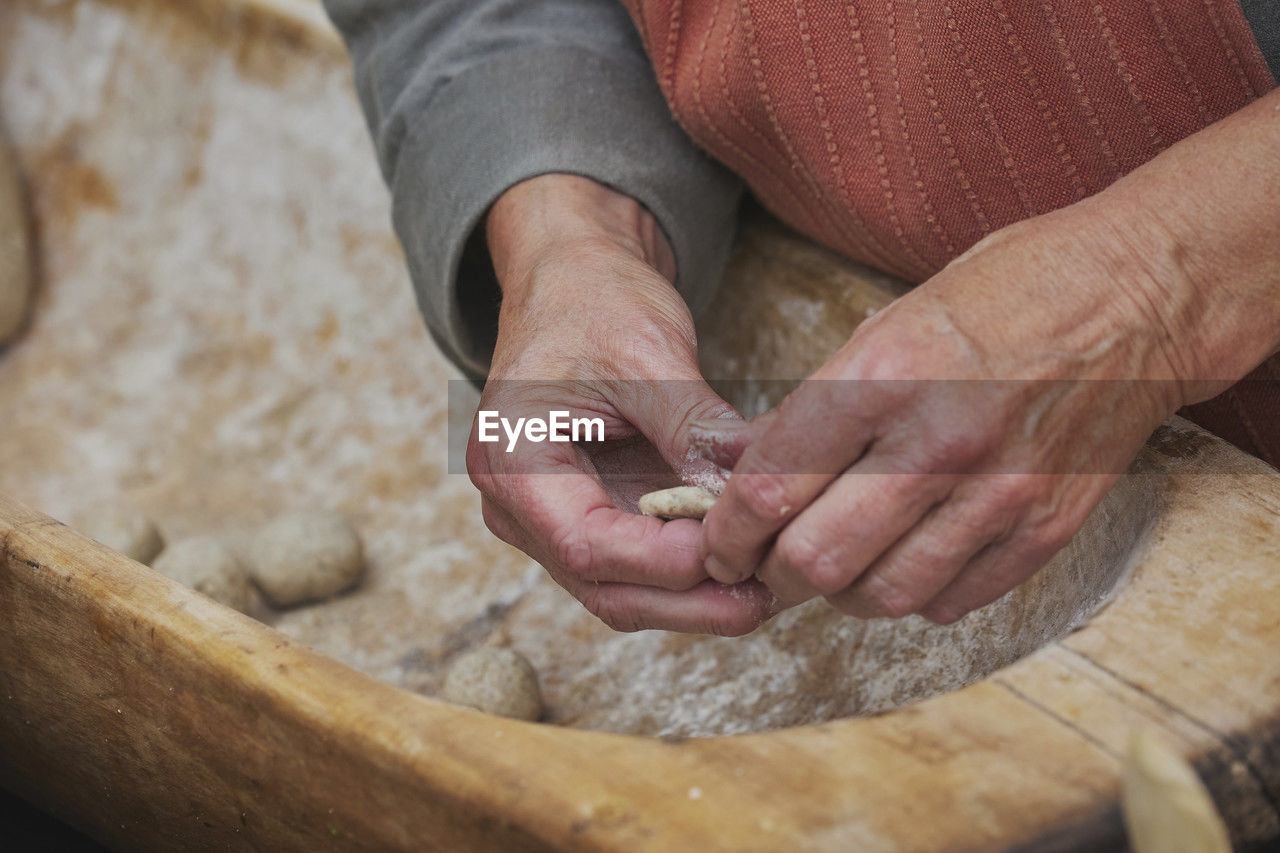 cropped image of man preparing food