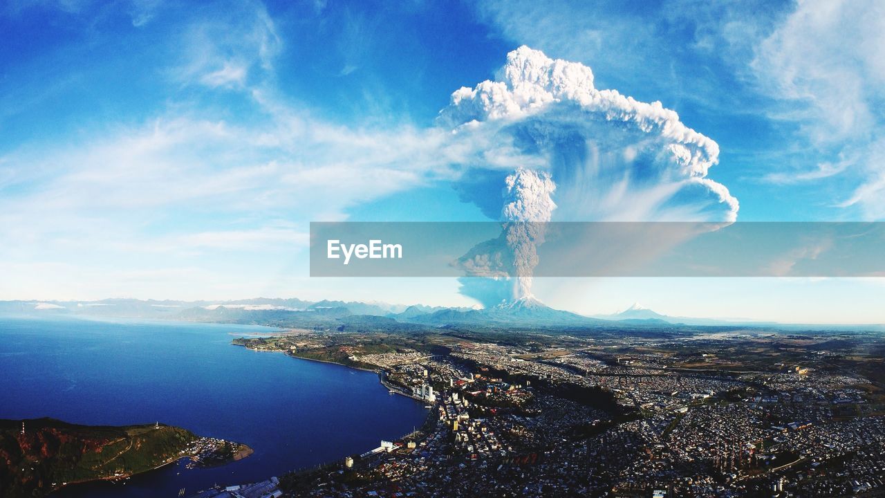 Scenic view of smoke emitting from volcano against sky