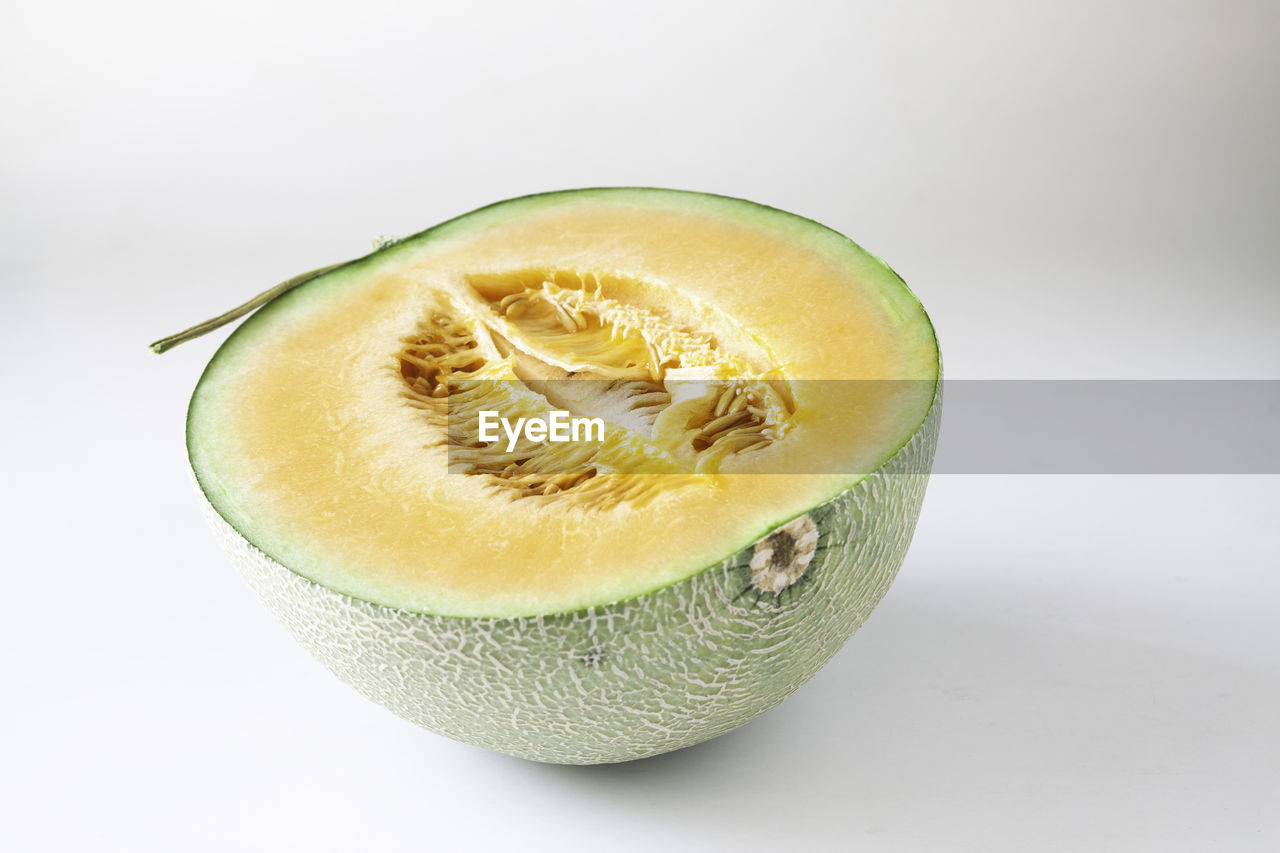 Close-up of cantaloupe against white background