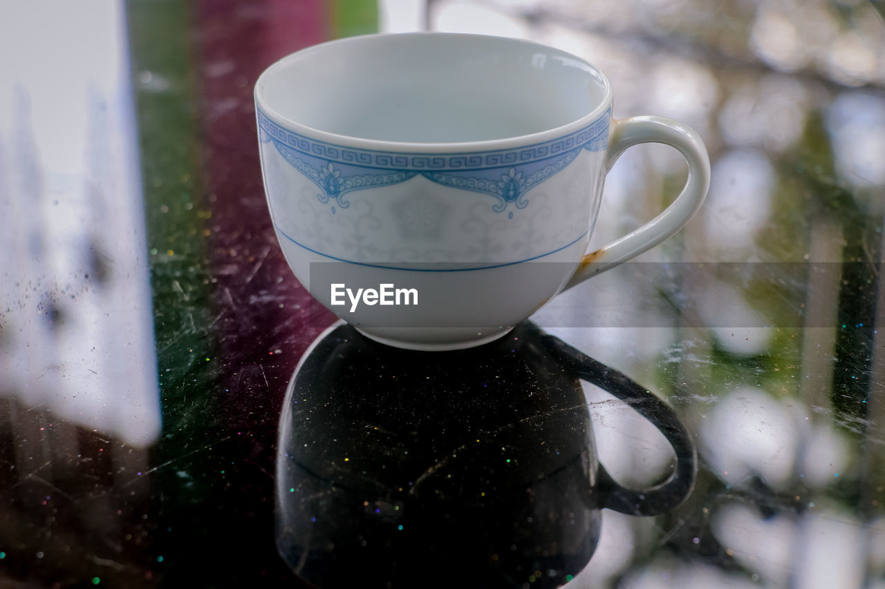 Close-up of coffee cup on table