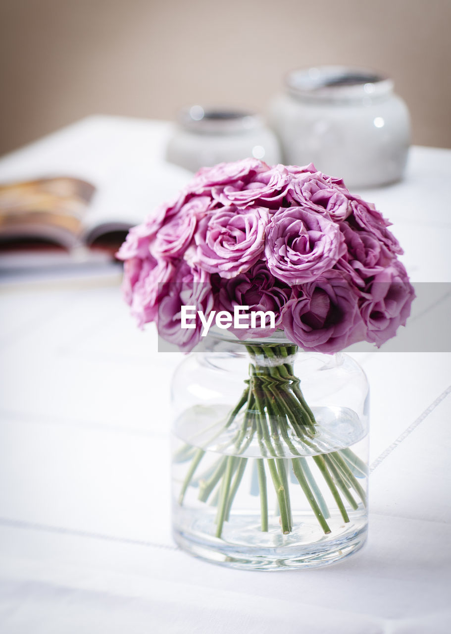 Close-up of flower vase on table